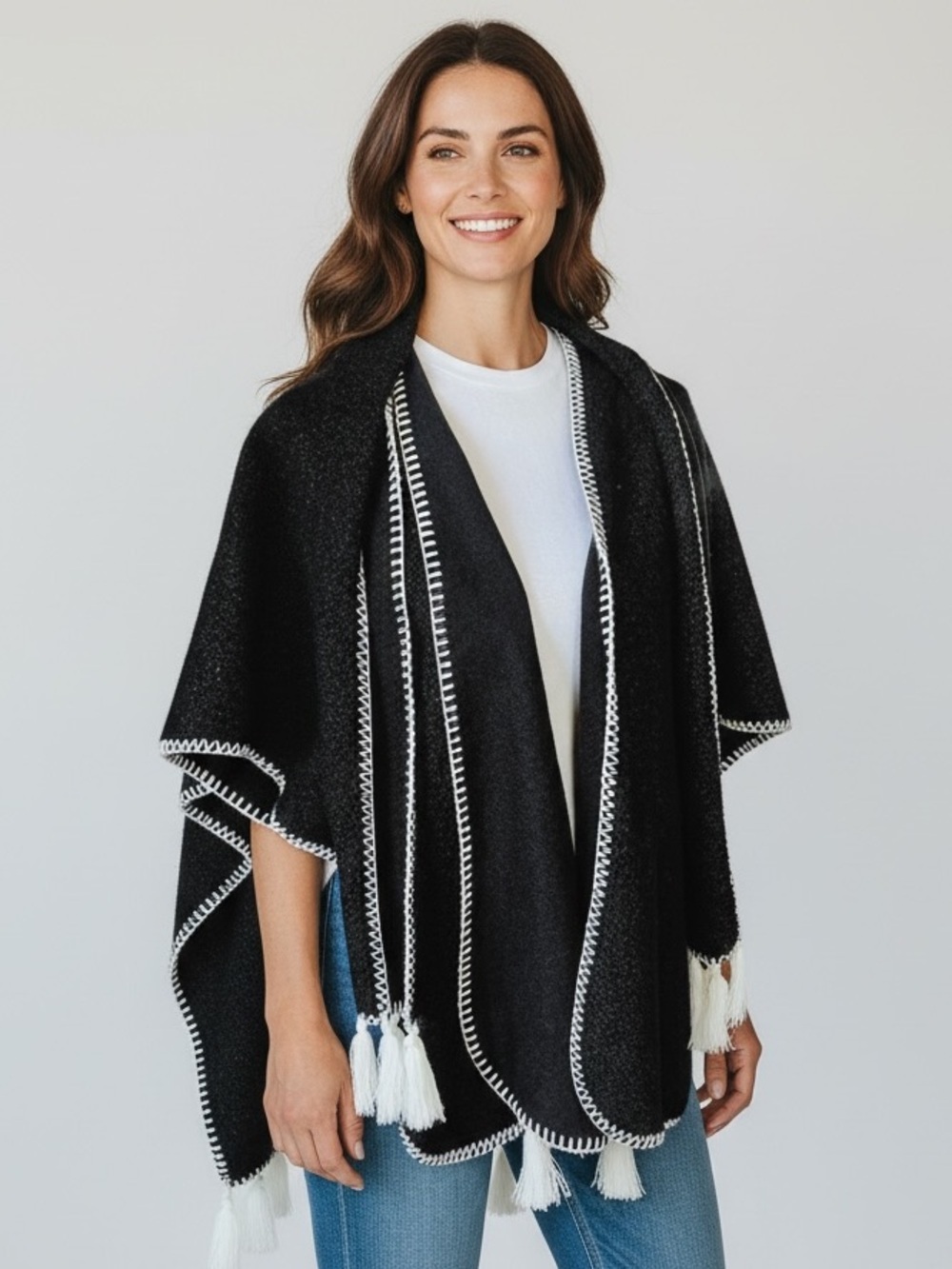 Black and White Tassel Trim Poncho Sweater one size NWOT. Perfect condition